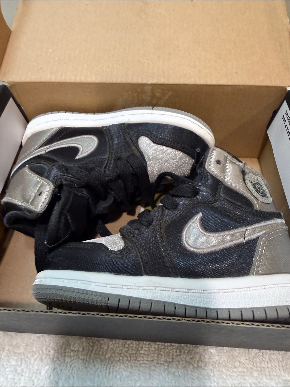 Nike Kids Black and Silver High-Top Sneakers with Metallic Accents